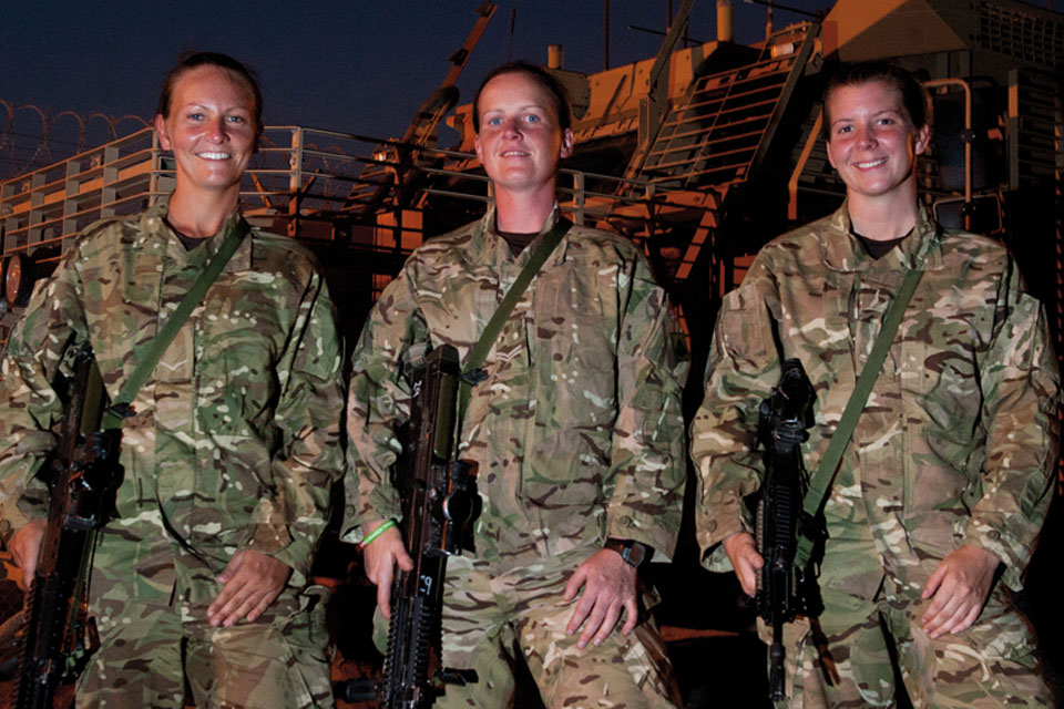 Lance Corporal Claire Scott, Corporal Amanda Giltrow and Lance Corporal Michelle Arnott of the Royal Signals prepare to take part in a trial using equipment in their Mastiff