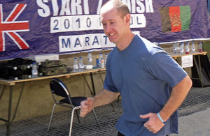 Corporal Field crosses the finish line at Camp Souter