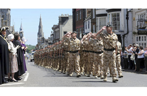 4 RIFLES march past council dignatories lining High West Street in Dorchester