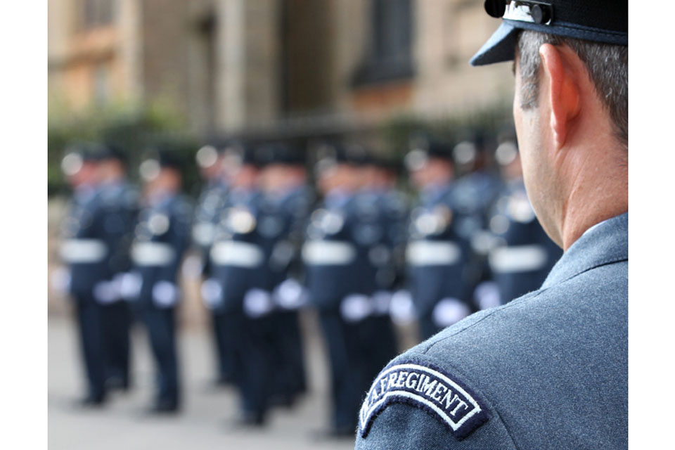 Officer Commanding 504 Squadron, Squadron Leader I J Ham, watches his men and women form up on parade in Hucknall in Nottinghamshire 