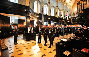The Sovereign's Colour of the Royal Auxiliary Air Force is paraded to the front of St Clement Danes