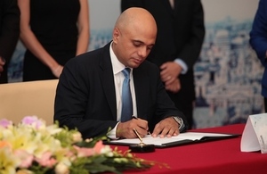 Sajid Javid signing a partnership agreement with Shanghai Cross-Border E-Commerce Public Platform