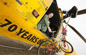 RAF Search and Rescue crewman Sergeant Lee Clark with two of his favoured modes of transport