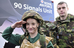 Senior Aircraftman Martin Calvert from 90 Signals Unit, based at RAF Leeming, shows Cory Bell some of the kit used on operations in Afghanistan (stock image)