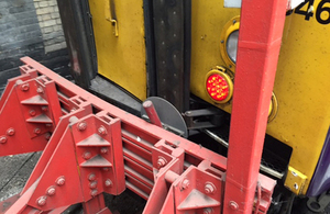 Image showing damage to train and buffer stops at Kings Cross station