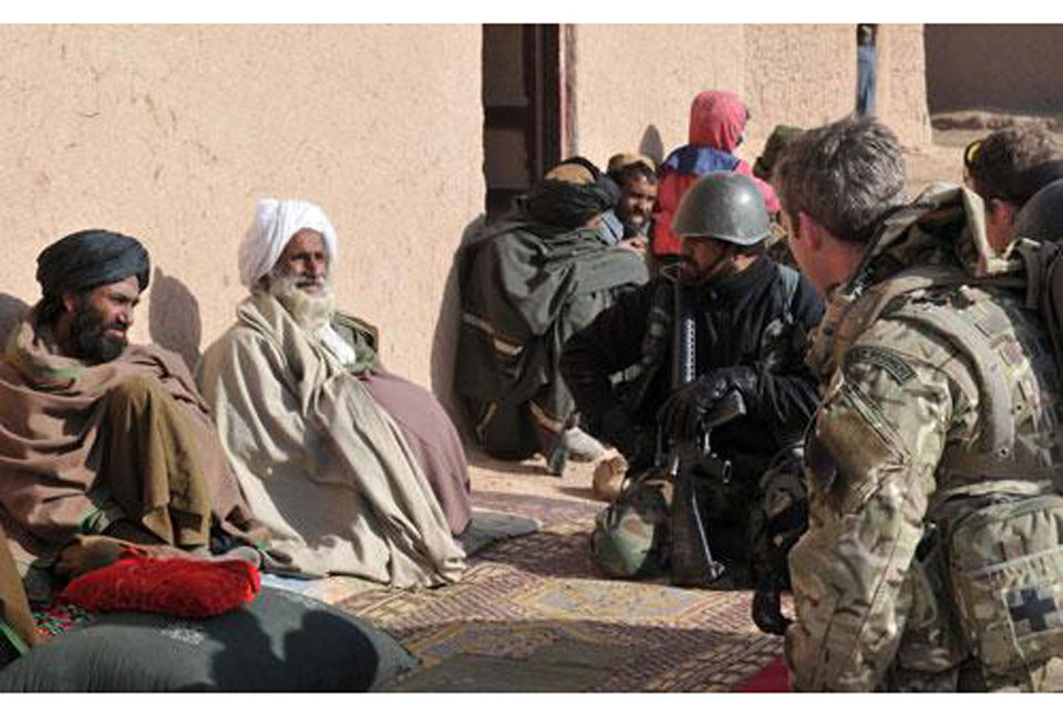 Members of II Squadron RAF Regiment and the Afghan National Army speak with local elders 