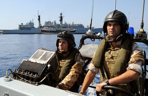 The crew of one of HMS Chatham's Pacific 24-foot (7.3m) rigid inflatable patrol boats speed off to investigate a suspected pirate vessel