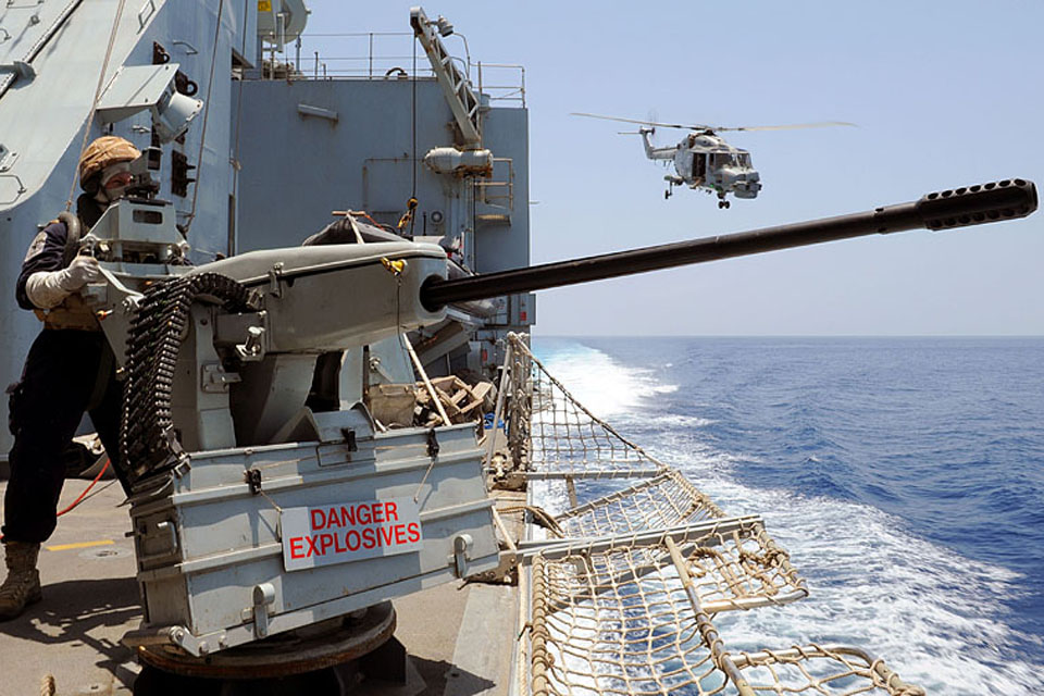 HMS Chatham goes 'hands to boarding stations' after closing on a suspected pirate vessel in the Gulf of Aden