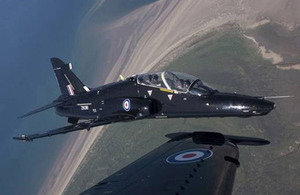 A Hawk jet from the RAF's No 4 Flying Training School at RAF Valley on Anglesey flies over the Welsh coast (stock image)