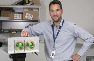 Yoann Thueux, project team leader, with laser beam communication equipment