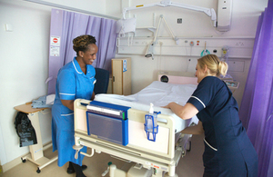 Nurses changing bed