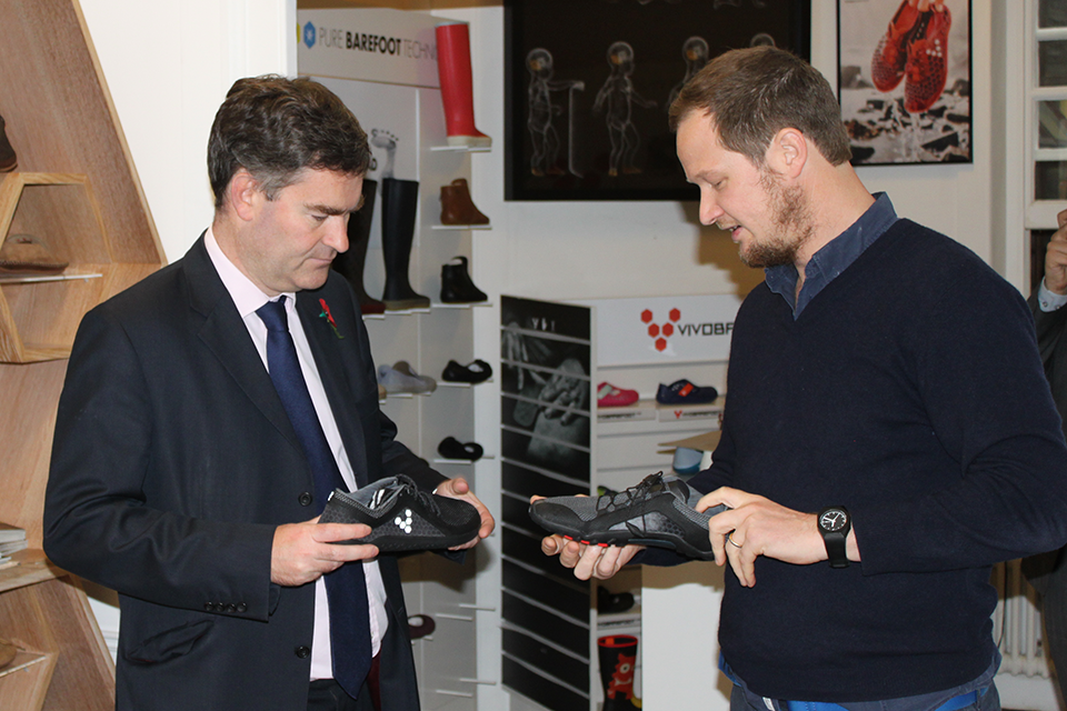 Financial Secretary David Gauke looking at the shoes