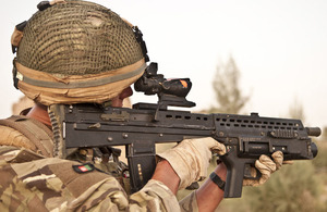 Highlander Mark Mackenzie, 4 SCOTS, checks his sector while patrolling in Lashkar Gah District, Helmand province