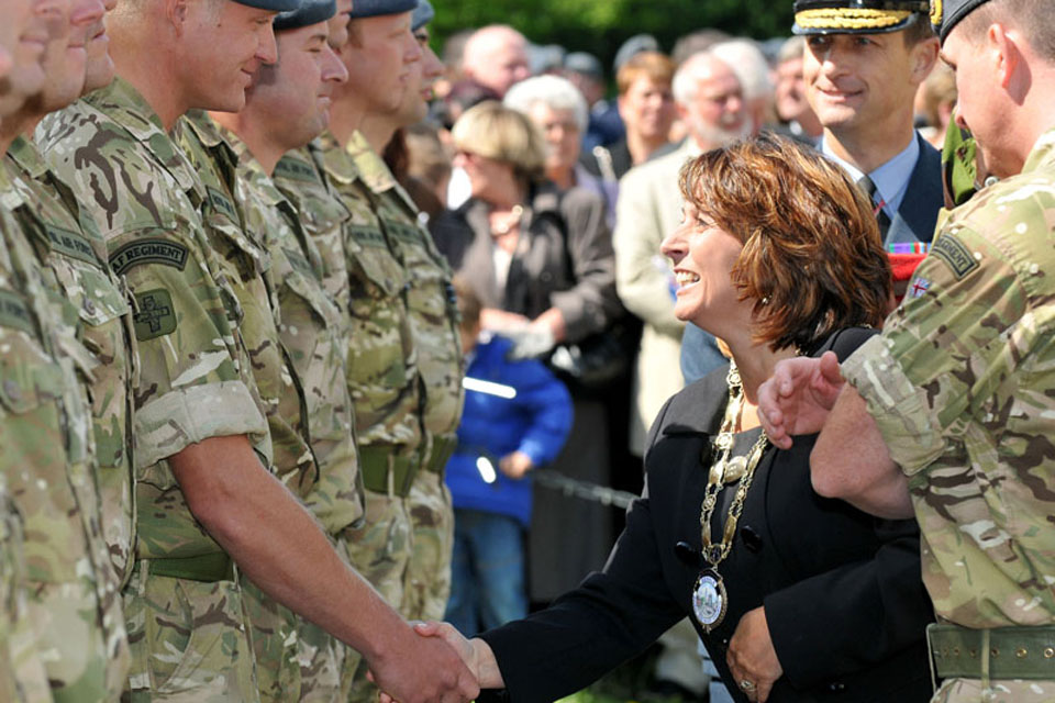 Councillor Mrs Amanda Coates, Mayor of Bedale, greets a Gunner from 34 Squadron RAF Regiment as she hands out Afghanistan campaign medals