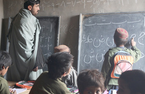 A teacher conducting a lesson at Rahim Kalay's new school