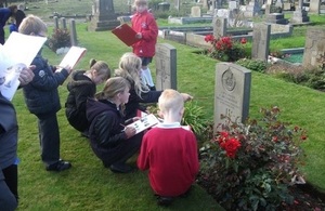 Children in Newcastle tidying war graves