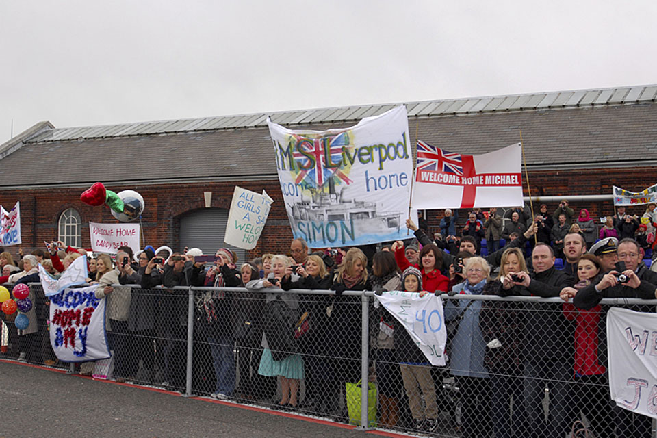 Families and friends of HMS Liverpool's ship's company await their loved ones' return
