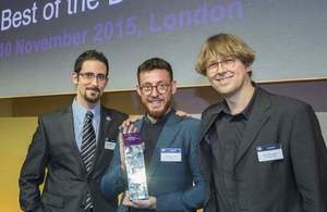 Miguel Martinez-Alvarez (left) and David Benigson of Signal Media (holding award) with Professor Udo Kruschwitz, of Essex University (right)