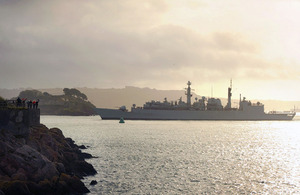 Friends and families wave to loved-ones as HMS Cornwall deploys on counter-piracy operations