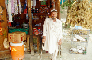 Abdul Bashir in front of his ship