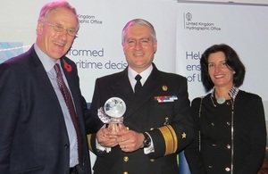 Admiral Patricio Carrasco receiving the award from Reserves Minister Julian Brazier