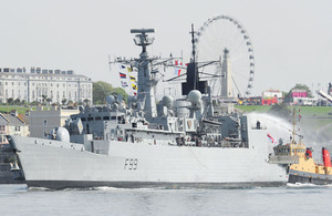 Families and friends of HMS Cornwall's company congregate en masse in the Plymouth sunshine to welcome home their loved ones