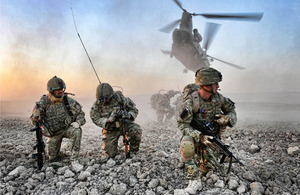 A member of a Fire Support Team from 7th Parachute Regiment Royal Horse Artillery radios headquarters following an insertion by air - winner of the Army Multimedia, Best Overall Image and Army Professional Photographer of the Year (Portfolio)