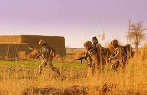 Soldiers running under fire during the ferocious battle with insurgents