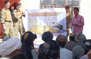 British soldiers give a presentation on veterinary care