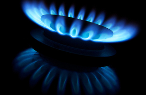 A gas ring with blue flames.