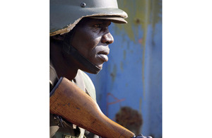 A Uganda People's Defence Force soldier takes cover during a mission rehearsal exercise at Singo training camp