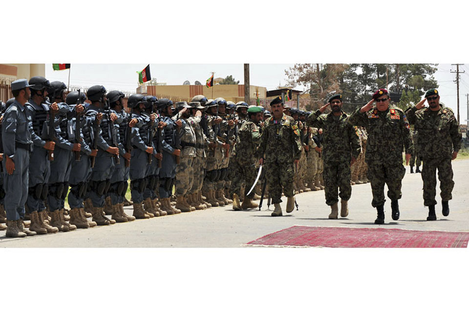 Members of the Afghan National Security Forces at the official handover ceremony of Lashkar Gah district centre from ISAF to Afghan control on 21 July 2011