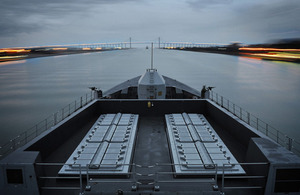 HMS Daring approaches the spectacular 'Friendship Bridge' on the Suez Canal just before dawn