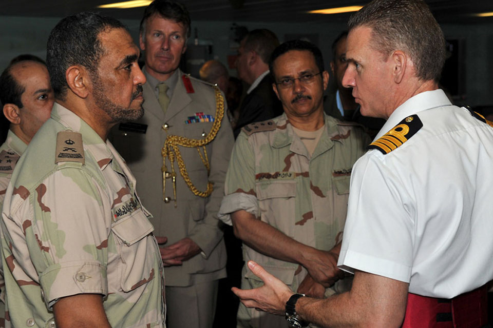 Captain Guy Robinson shows Saudi naval personnel around HMS Daring's Operations Room