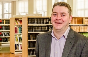 Russell Clifton in a library