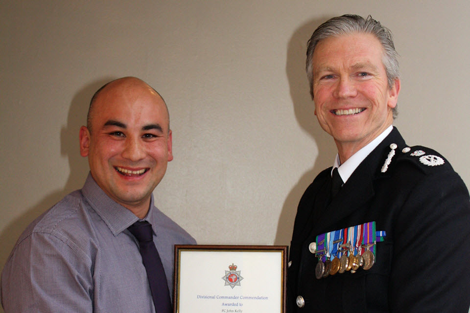 PC John Kelly receives his commendation from the Chief Constable