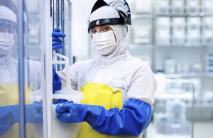 A worker in a cleanroom