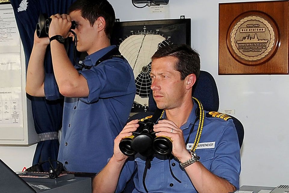 Commanding Officer Captain William Warrender (right) on the bridge of HMS Dauntless