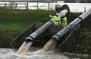 Environment Agency staff with temporary pumps at Mawdesley Pumping Station, Lancashire