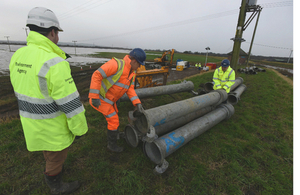 Environment Agency staff installing pumps at Croston, Lancashire to help with ongoing repairs to flood defences.