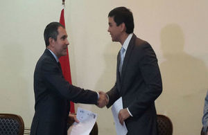 Ambassador Hobbs and Santiago Peña sign the agreement