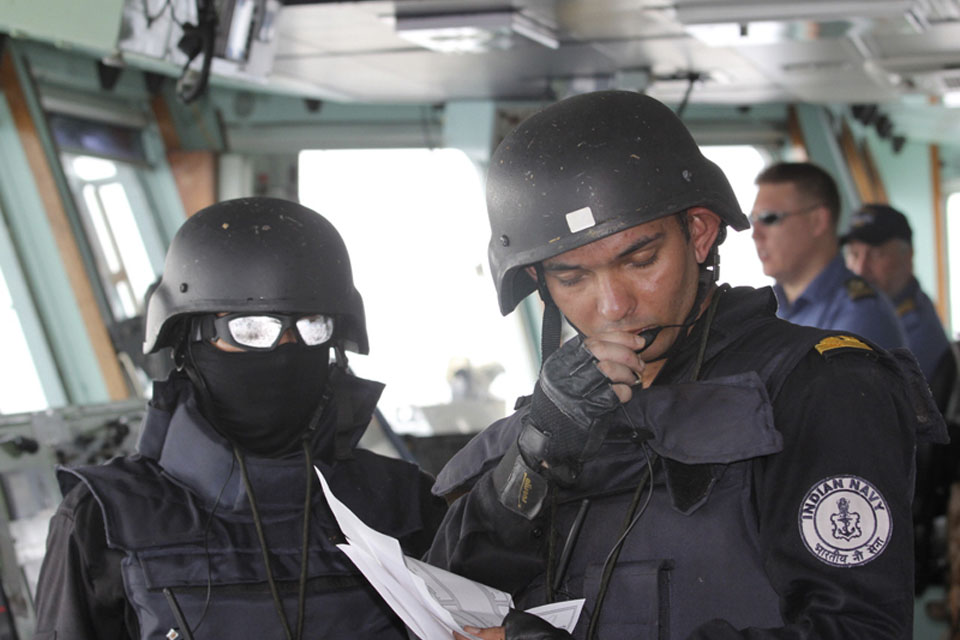 An Indian Navy sailor relays orders from the bridge during Exercise Konkan  