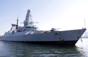 HMS Daring at Harumi pier in Tokyo with JDS Teruzuki in December 2013, returning from the Philippines where both ships provided disaster relief for Typhoon Haiyan.