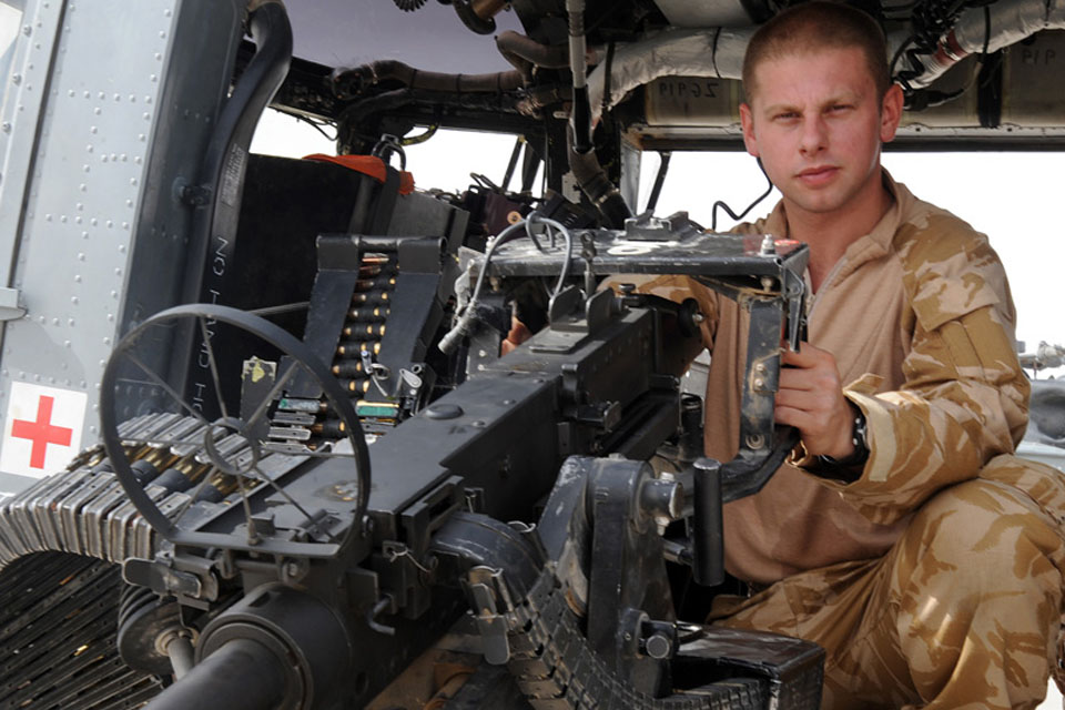 Lance Corporal Gary Lovett is in control of a .50 calibre heavy machine gun as a 'door gunner' in a Lynx Mark 9A helicopter