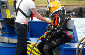 Specialist diver preparing to install the diffuser