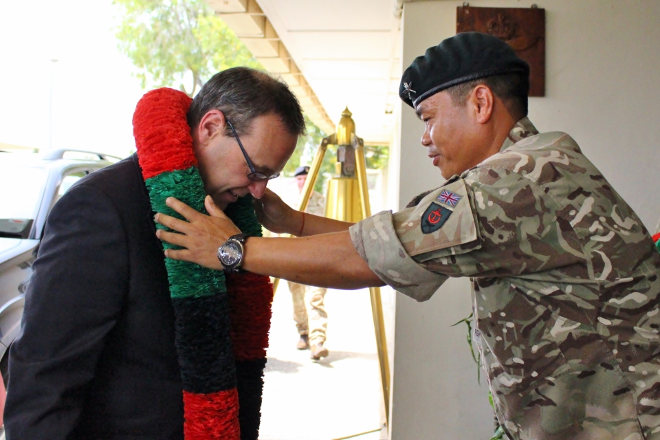 Sir Simon being welcomed in a traditional Gurkha way at the British Garrison by Gurkha Major, Major Chandrabahadur Pun