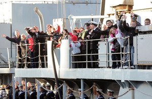 Members of the ship's company and families on board HMS Manchester as she returns to Portsmouth (stock image)