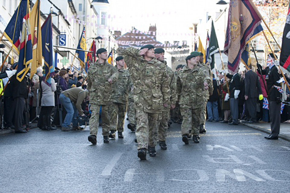 Crowds cheer on soldiers of 1st Battalion The Rifles as they march through Chepstow (stock image)