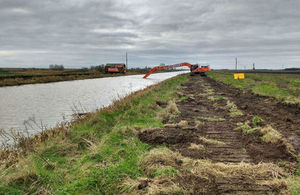 Long reach excavator working to desilt Old Bedford River