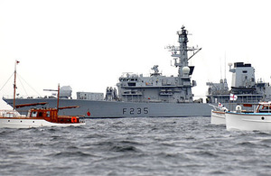 HMS Monmouth sails alongside the Dunkirk Little Ships flotilla to commemorate the 70th anniversary of the World War Two evacuation